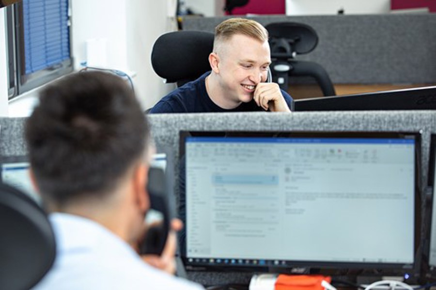 A member of the Alacer team on a call with a customer